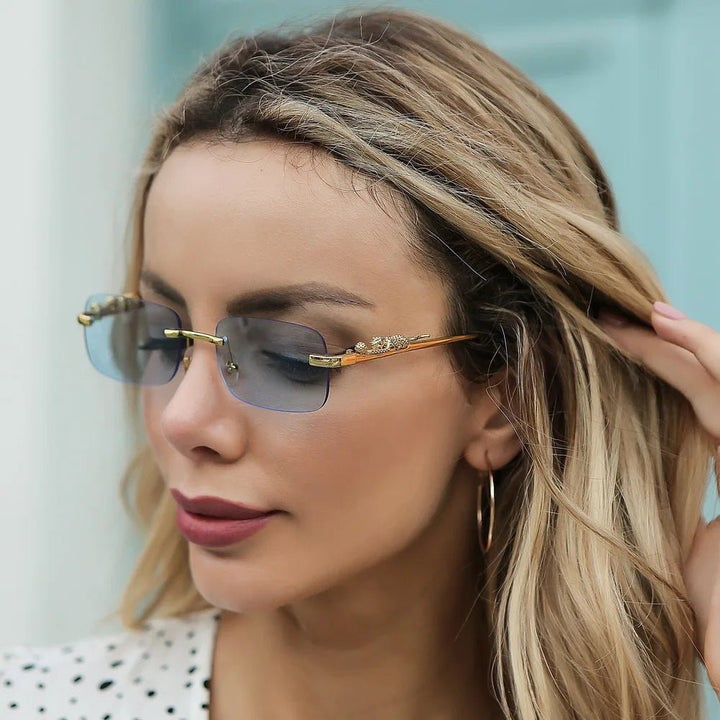 Sleek rimless unisex sunglasses with UV400 eye protection & gradient fashion lenses.