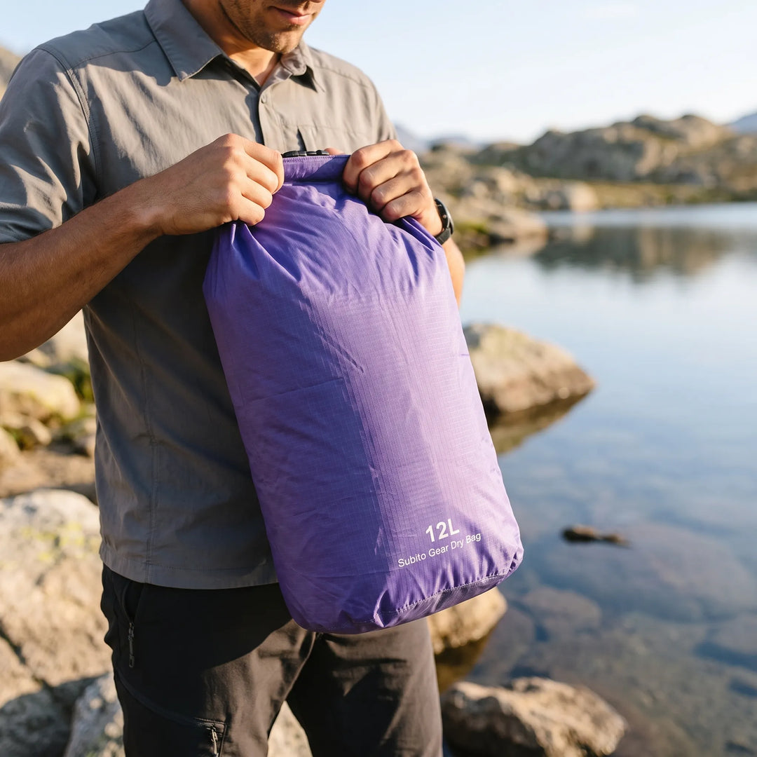 Unisex adventure travel dry bag, keeps gear dry for camping, hiking, & water sports.