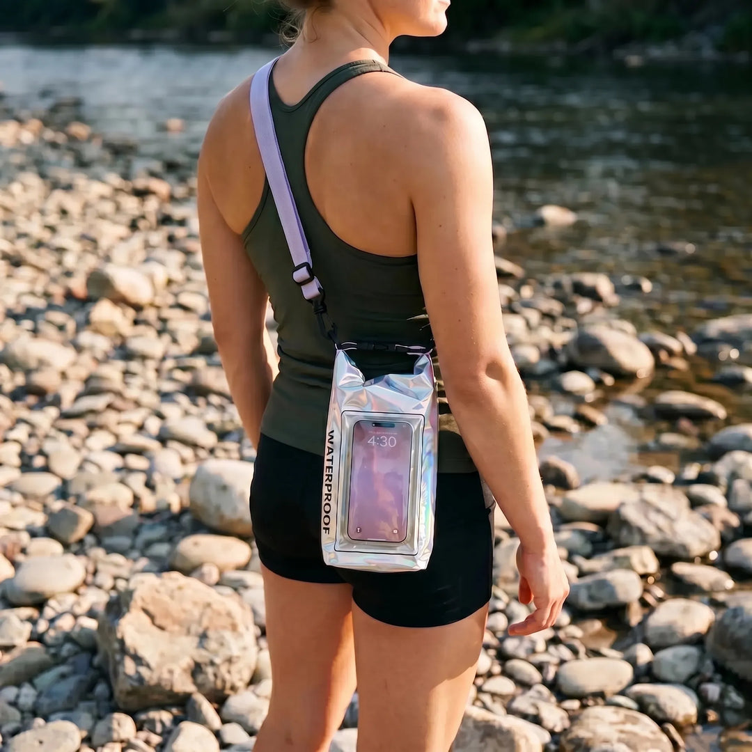 Unisex roll-top waterproof dry bag with clear touchscreen window for phone use during water sports & hiking.