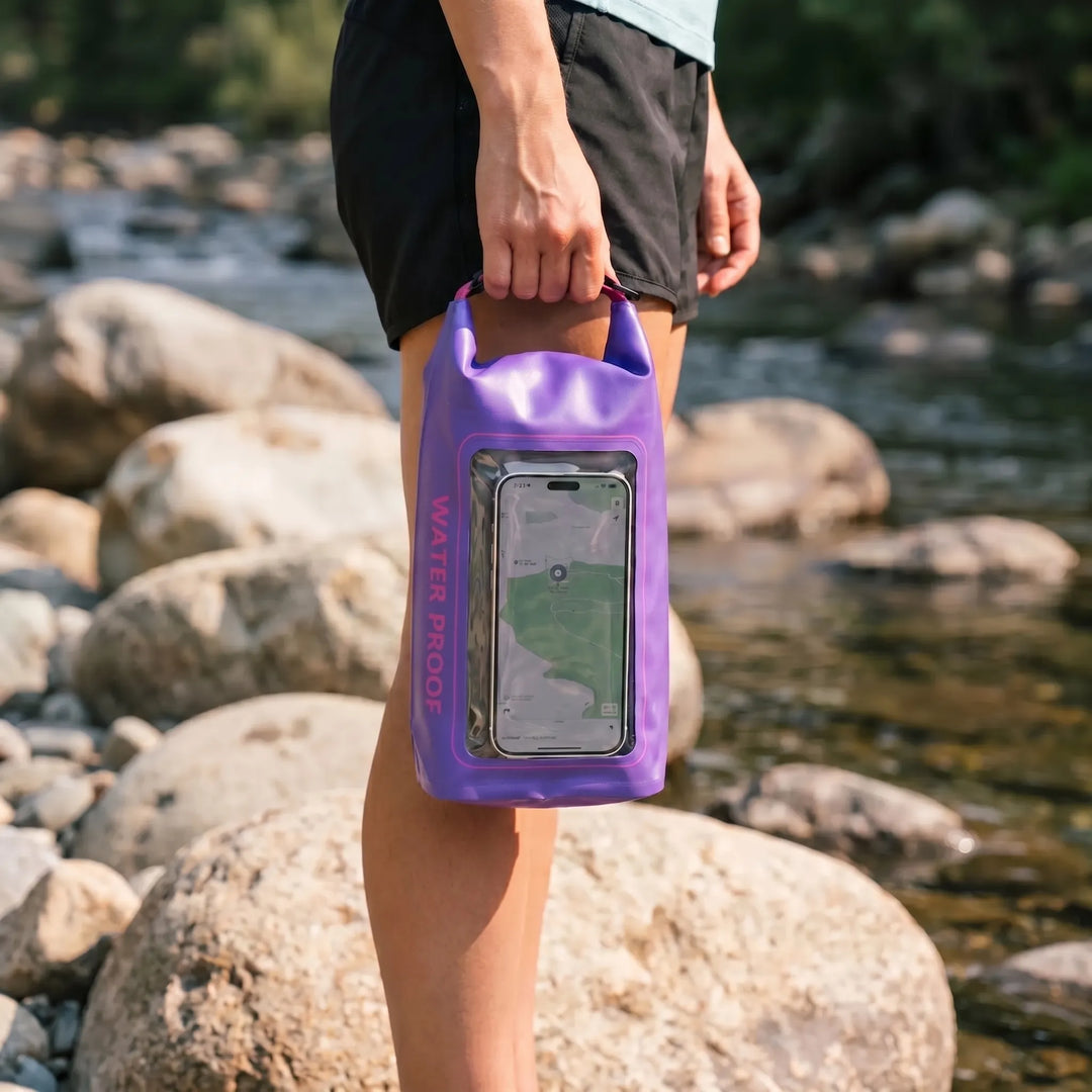 Essential outdoor gear: roll-top waterproof bag for camping, hiking, keeping items dry & accessible.