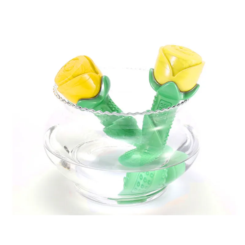 Yellow rubber dog chew toy in a rose shape, providing dental care and enrichment