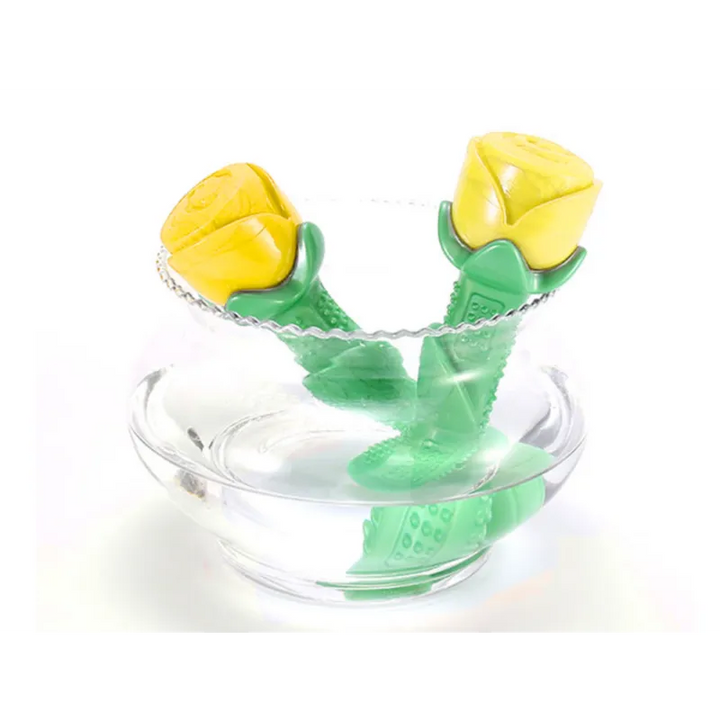 Yellow rubber dog chew toy in a rose shape, providing dental care and enrichment