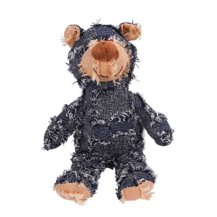 Close-up of a rustic denim plush bear dog toy, highlighting its durable texture for chewers.