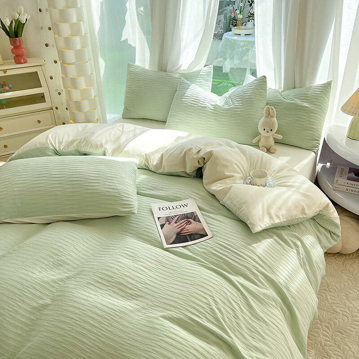 Wrinkle-resistant polyester seersucker bedding set in a crisp white solid color, ideal for bedroom decor.