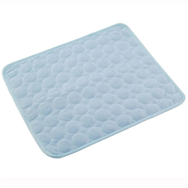Portable pet bed and self-cooling mat, rolled up for easy travel, durable and ready for outdoor adventures.