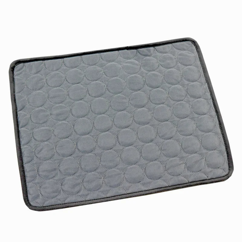 A cat enjoying a nap on a washable, self-cooling pet mat, illustrating pet comfort in summer heat.