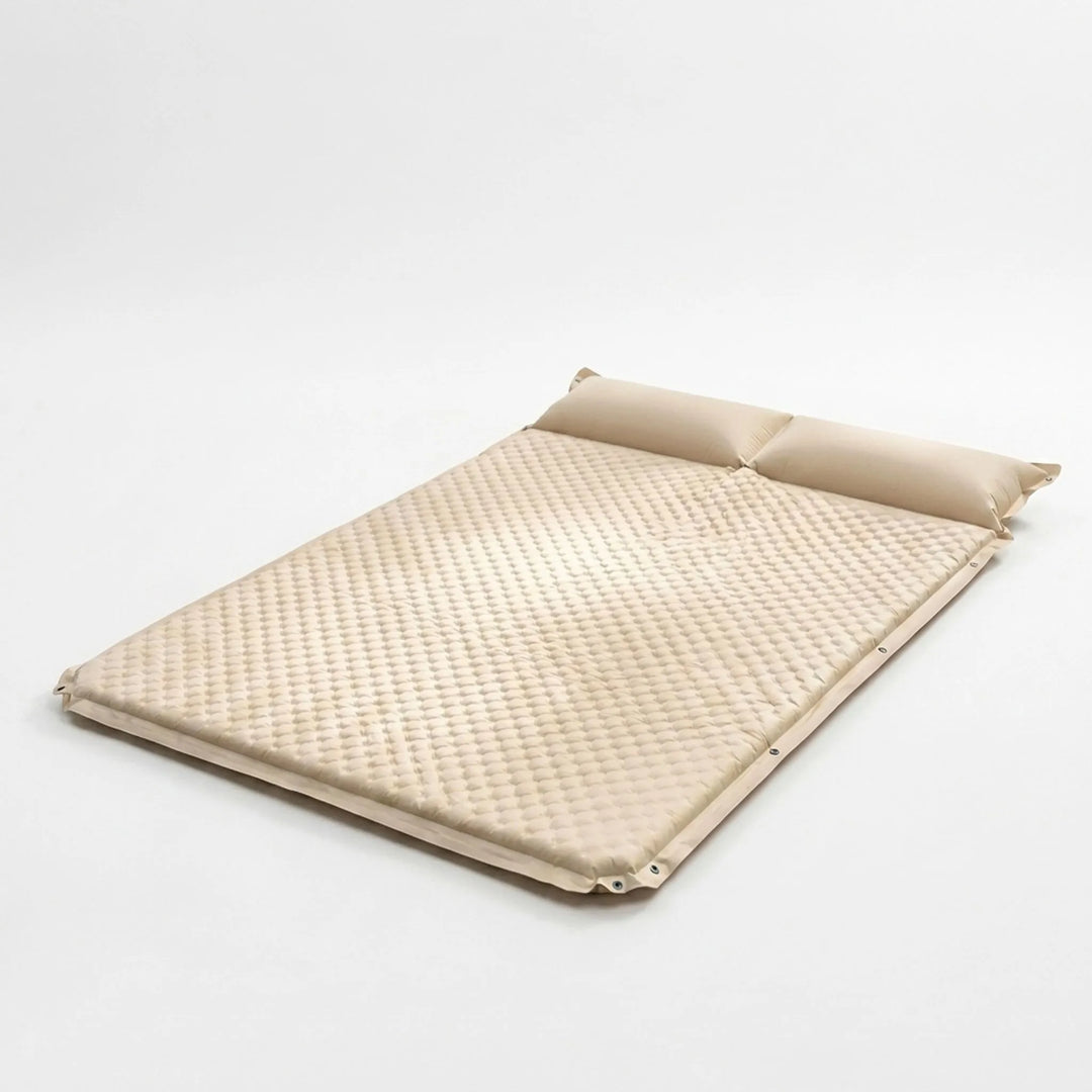 Cream self-inflating sleeping pad, perfect travel gear for camping & backpacking. Quick setup, ensures camp comfort in any tent.