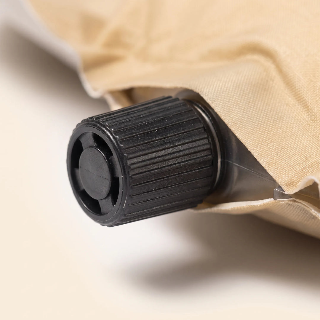 Compact unisex self-inflating sleeping pad. Essential outdoor gear for backpacking, camping, and tent adventures. Easy to carry.
