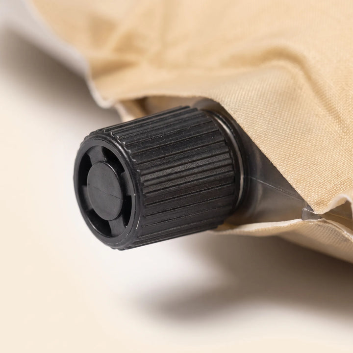 Compact unisex self-inflating sleeping pad. Essential outdoor gear for backpacking, camping, and tent adventures. Easy to carry.