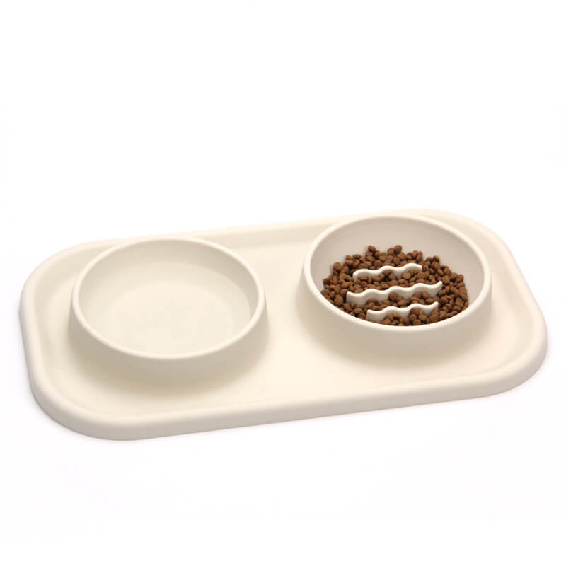 Unisex silicone slow feeder dog bowl with two compartments, promoting pet health and slower eating.