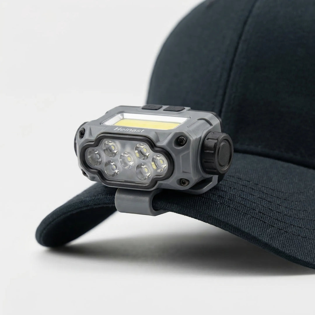Compact clip-on LED cap light, perfect for hiking & camping, offering bright hands-free illumination.