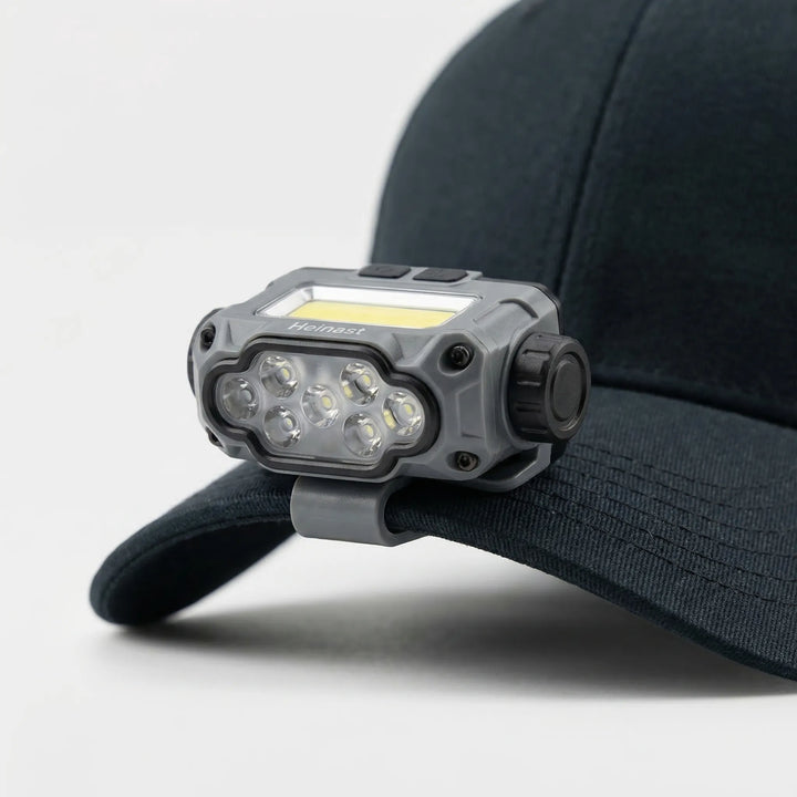 Compact clip-on LED cap light, perfect for hiking & camping, offering bright hands-free illumination.