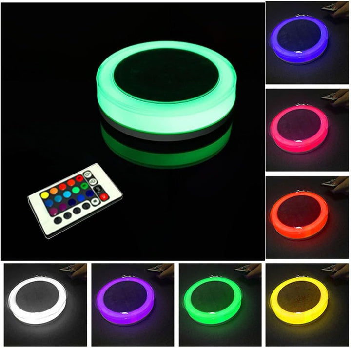 Waterproof solar floating RGB LED pool light changing colors in a garden pond