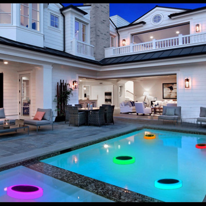 Bright RGB LED solar floating pool light adding ambiance to an outdoor space