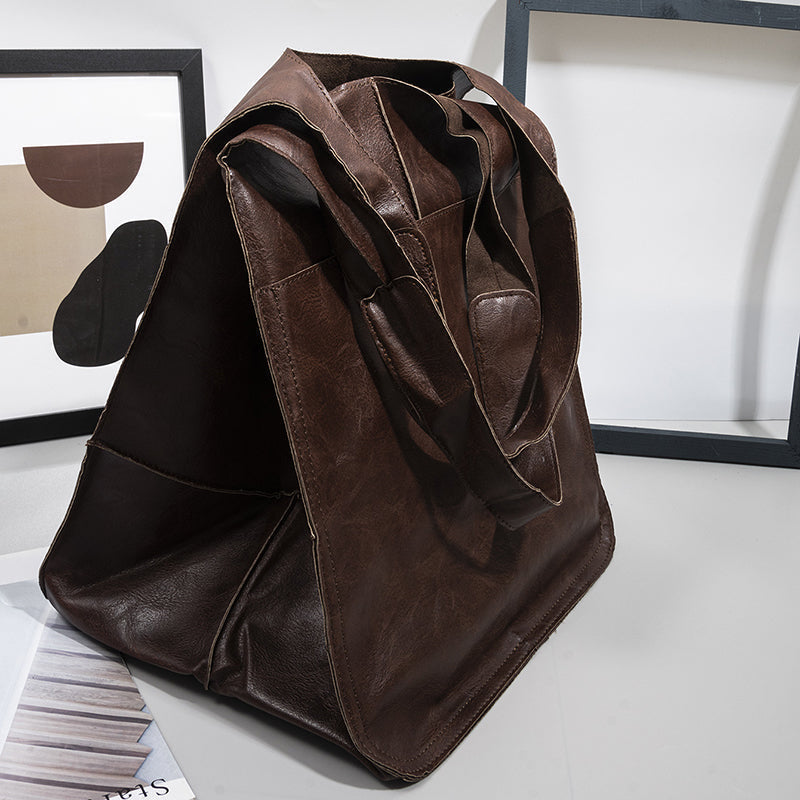 Stylish unisex shoulder bag, an oversized duffel for modern travelers.