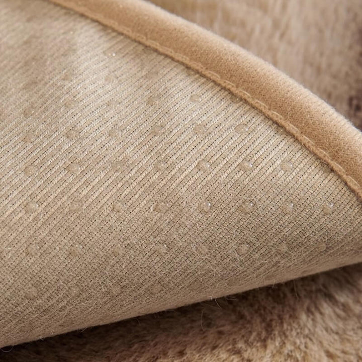 Comfortable striped faux rabbit fur couch cover, adding warmth and style to any sofa