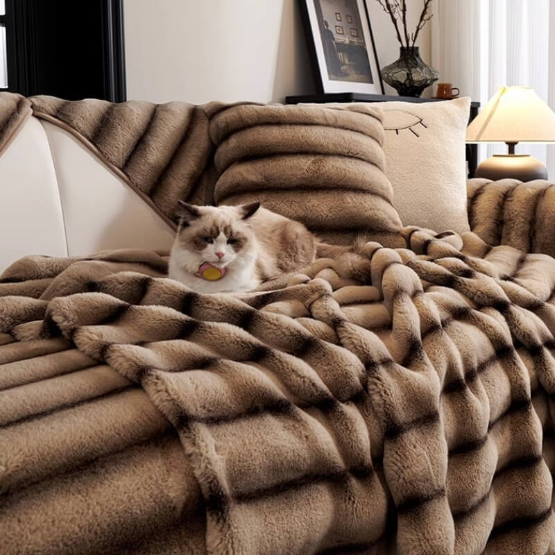 Striped faux fur sofa cover with non-slip backing, perfect for furniture protection