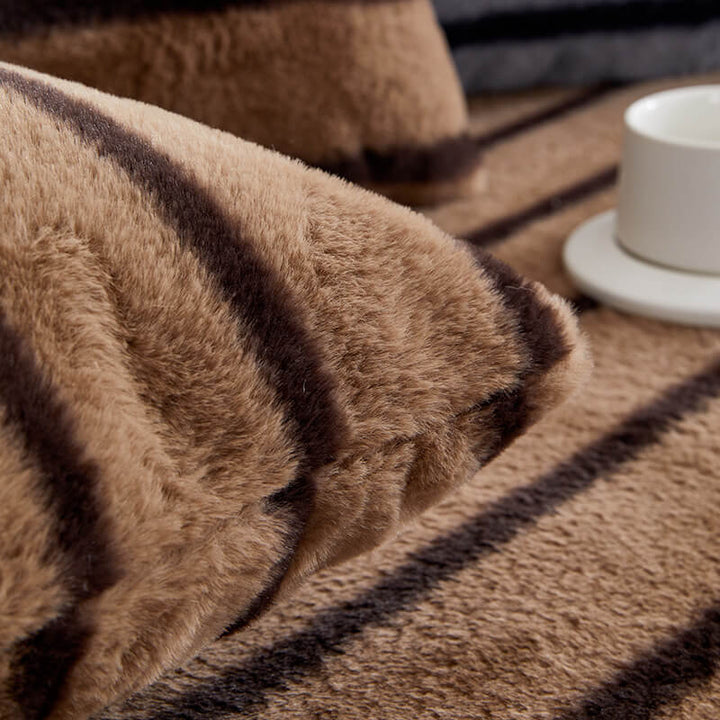 Stylish striped couch cover made of faux rabbit fur, stain resistant & durable