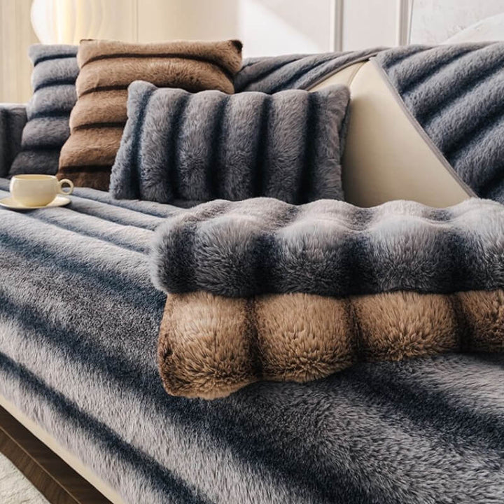 Unisex striped faux fur couch cover protecting a sofa from daily wear and tear