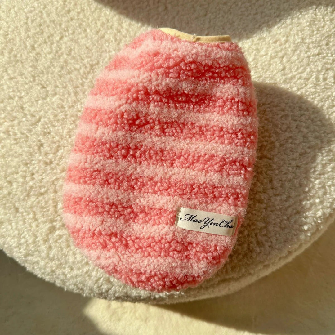 Stylish striped dog coat, a warm pet clothing option for chilly weather.
