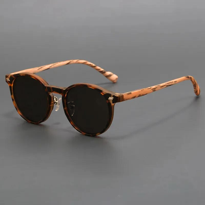 Unisex stylish round sunglasses with dark lenses & UV protection, a must-have fashion accessory for eye protection.