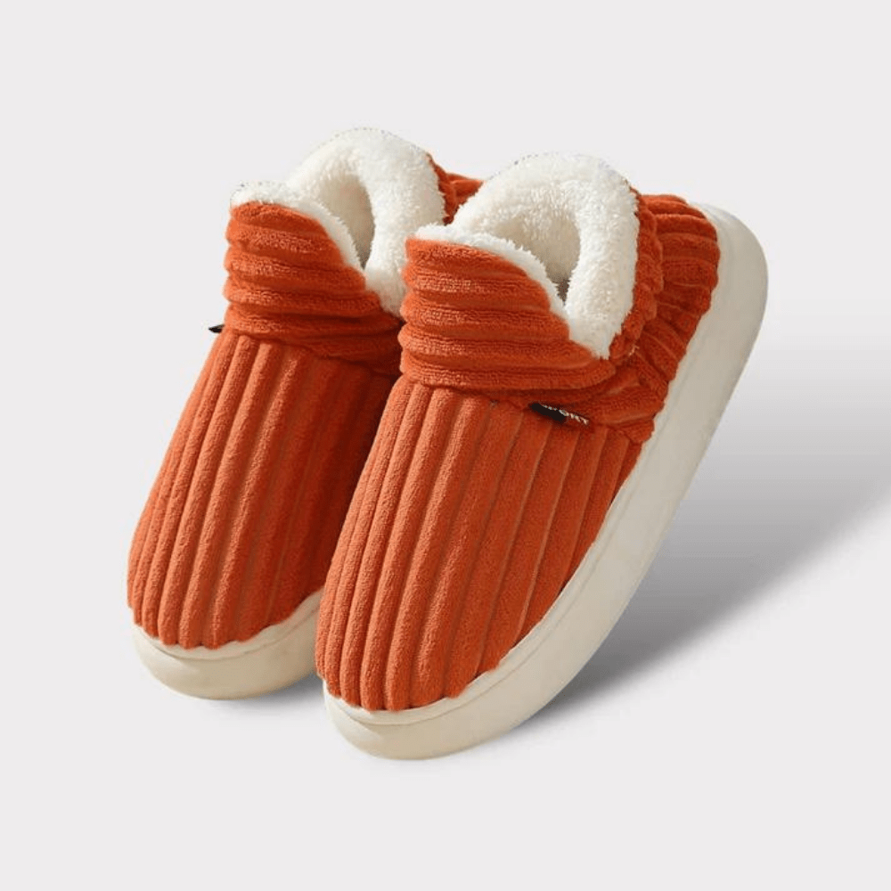 Side view of a grey thermal house slipper, emphasizing its cozy and warm winter design.