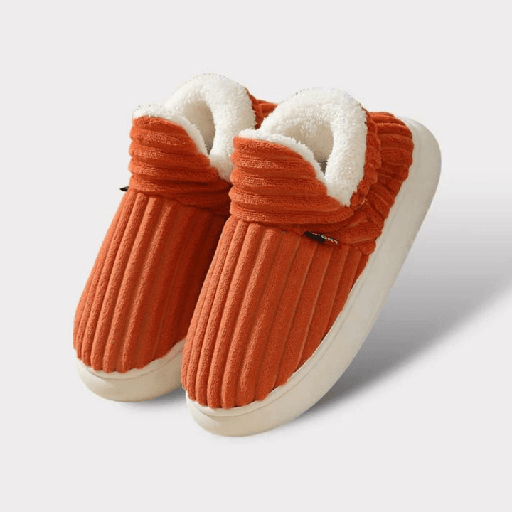 Side view of a grey thermal house slipper, emphasizing its cozy and warm winter design.