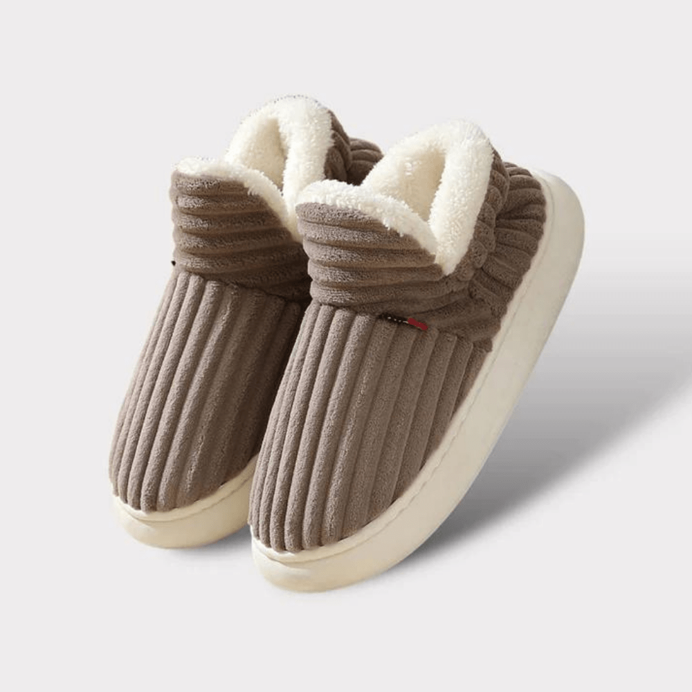 Unisex winter thermal slippers, offering cozy comfort with an easy-care plush finish.