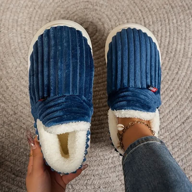 Close-up of plush thermal house slipper fabric, highlighting warmth and cozy texture.