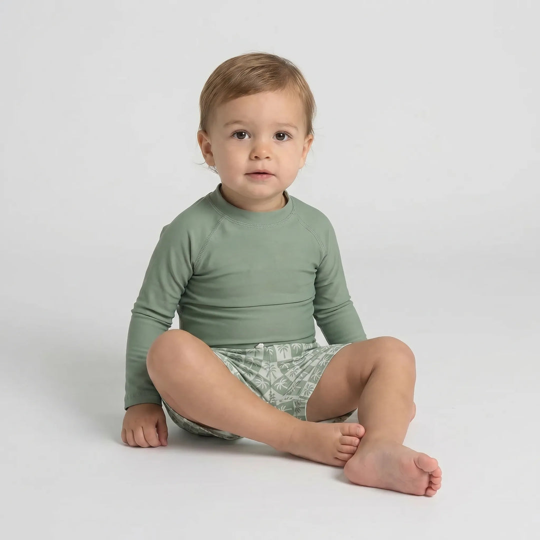 Close-up of quick-dry fabric on a long sleeve toddler swimwear set, designed for sun protection and comfort.