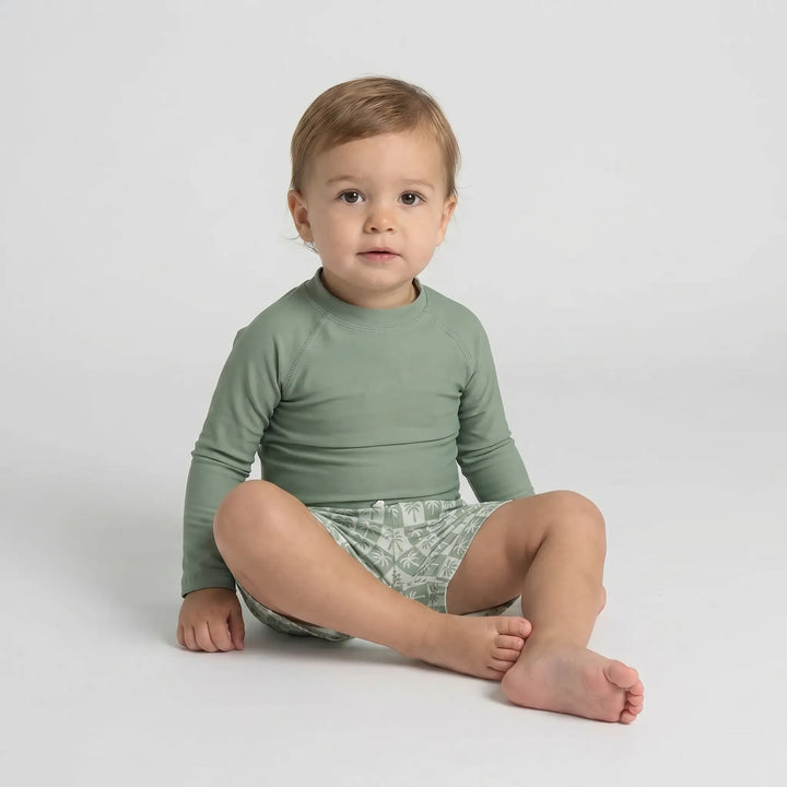 Close-up of quick-dry fabric on a long sleeve toddler swimwear set, designed for sun protection and comfort.
