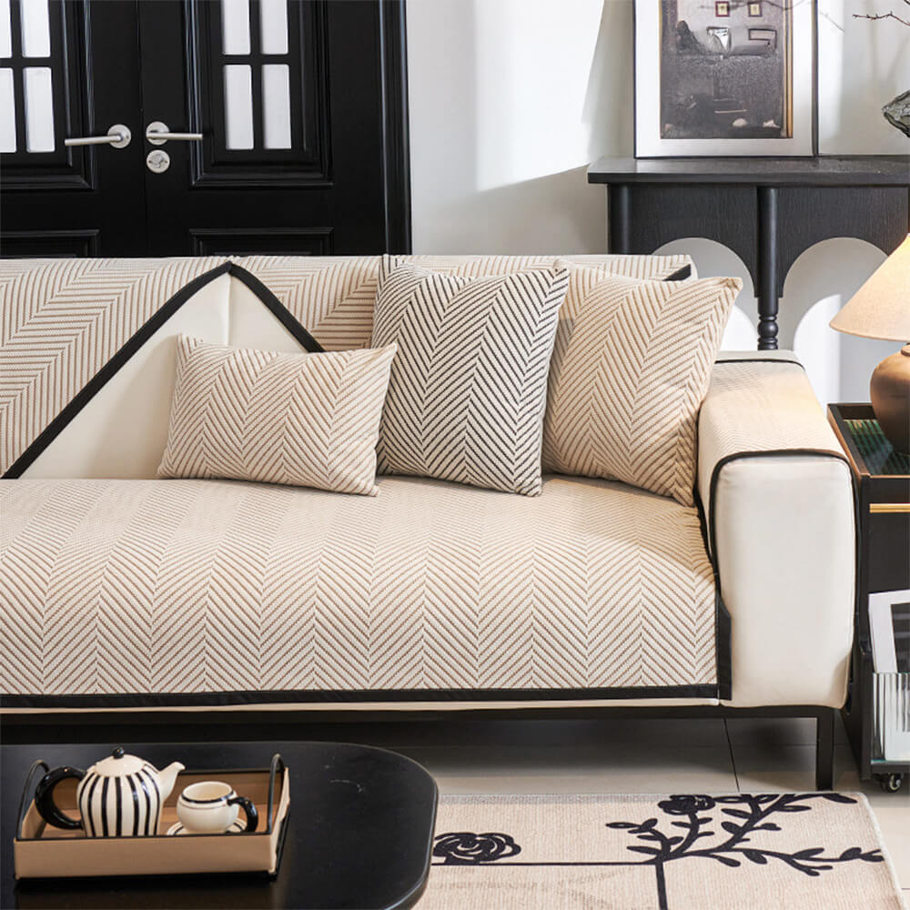 Full view of non-slip unisex two-tone herringbone fleece couch cover on a sofa
