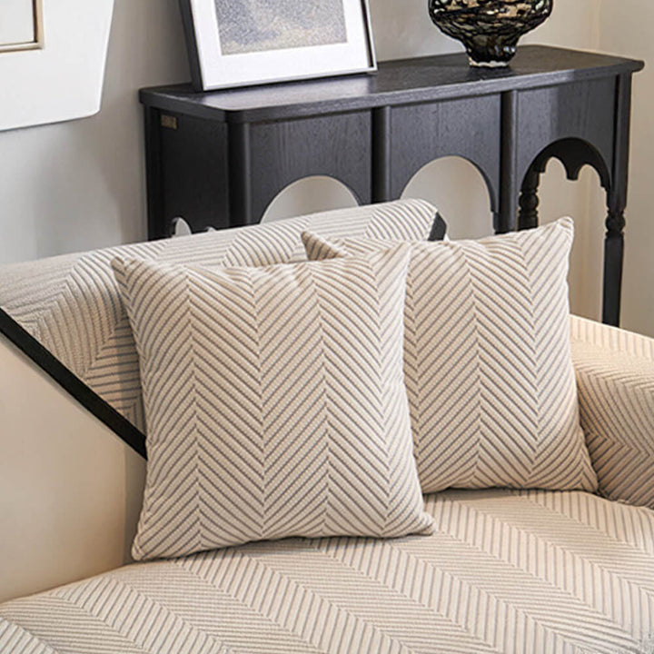 Back view of two-tone herringbone fleece couch cover showing non-slip backing, a home accent