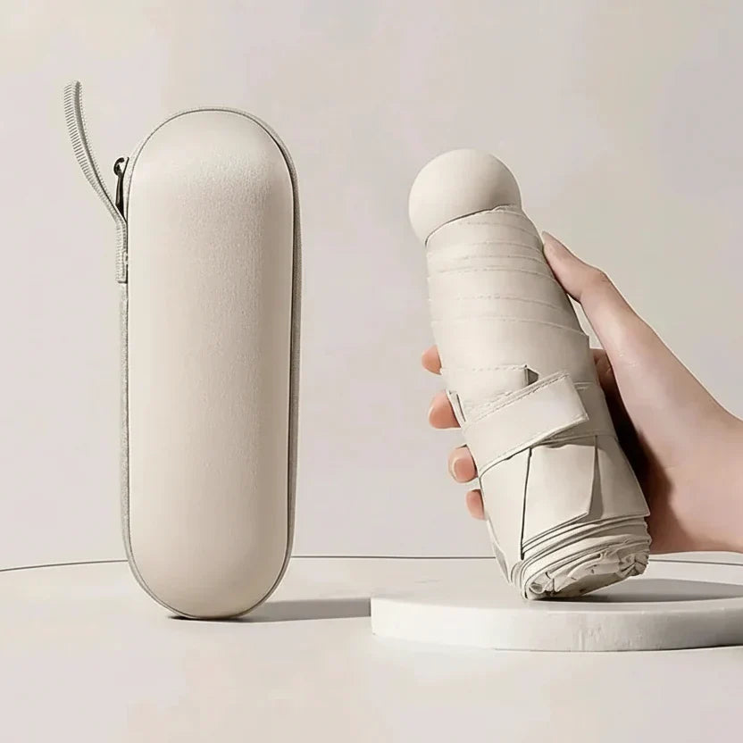Portable rain gear: a sleek, ultra-compact travel umbrella, essential for sudden downpours.
