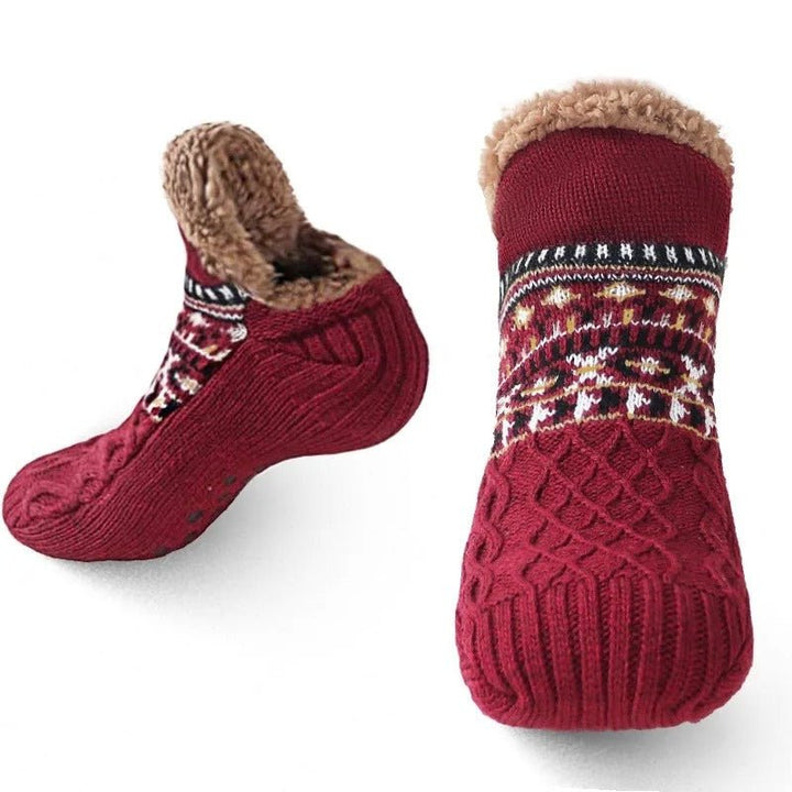 Plush, ultra-soft slipper socks with non-slip treads, providing cozy warmth and secure footing indoors.