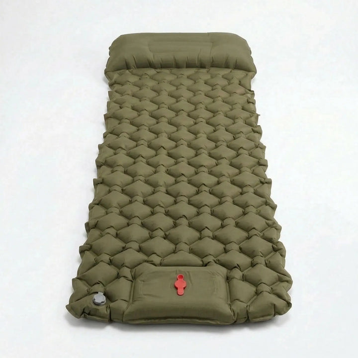 Inflated ultralight sleeping pad in a tent, showing built-in pump. Ideal for camping, hiking, and travel comfort.