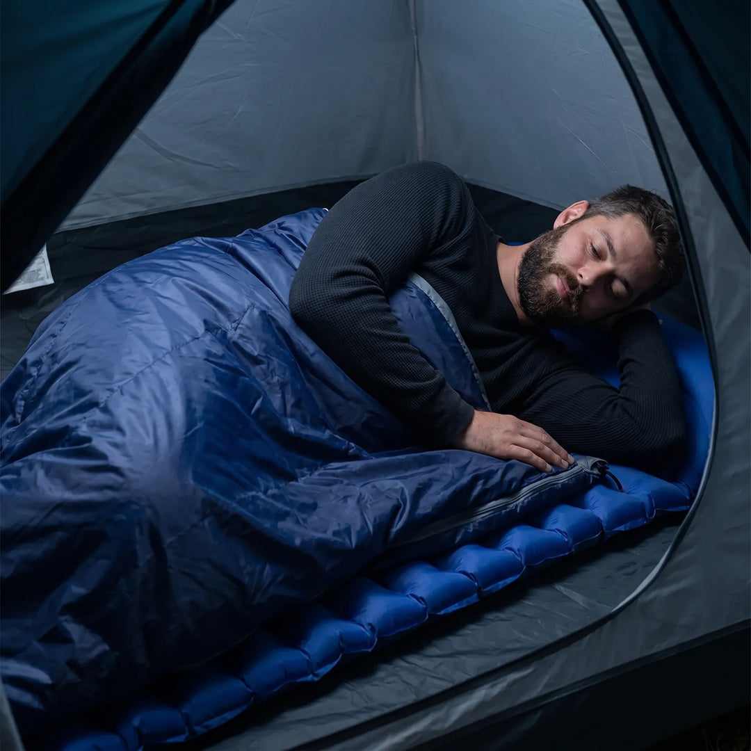 Compact travel sleeping bag for summer hiking, easy to pack and carry.