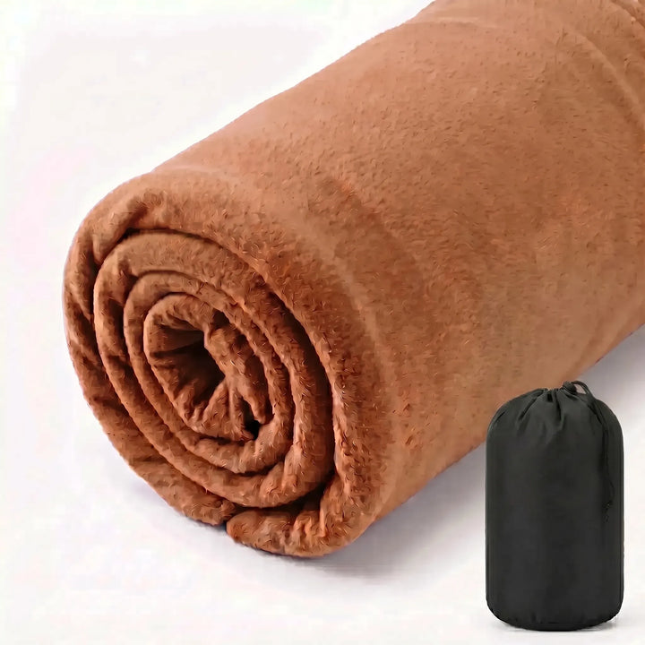 Outdoor-ready ultralight fleece liner, essential for campers & travelers seeking comfort & portability.