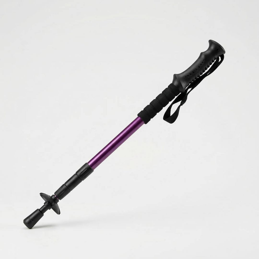 Folding trekking pole on a scenic mountain trail, ready for adventurous hikes & compact backpacking.