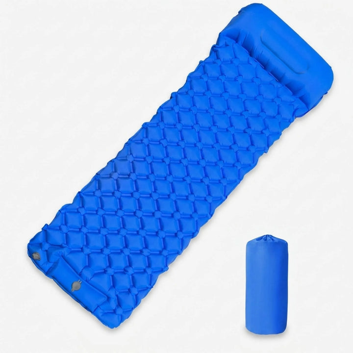Hiker relaxing on an ultralight inflatable camping sleeping pad, perfect gear for comfortable backpacking and outdoor trips.