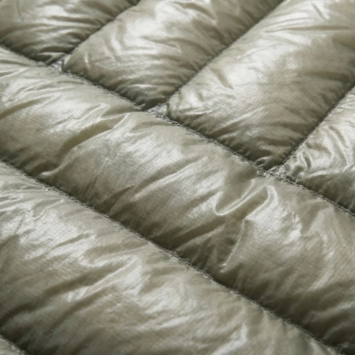 Compact & ultralight unisex mummy down sleeping bag for backpacking. Essential gear for outdoor warmth.