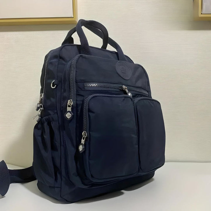 Sleek urban waterproof backpack, a multi-pocket daily carry solution for men & women.