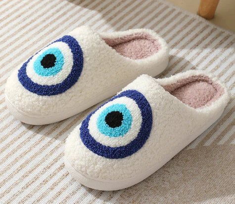 Adorable festive deer motif on warm, non-slip unisex house slippers, perfect for holiday cheer.