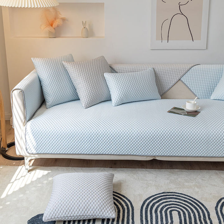 Multiple colors of washable cooling anti-scratch sofa covers stacked, showing versatile home decor options