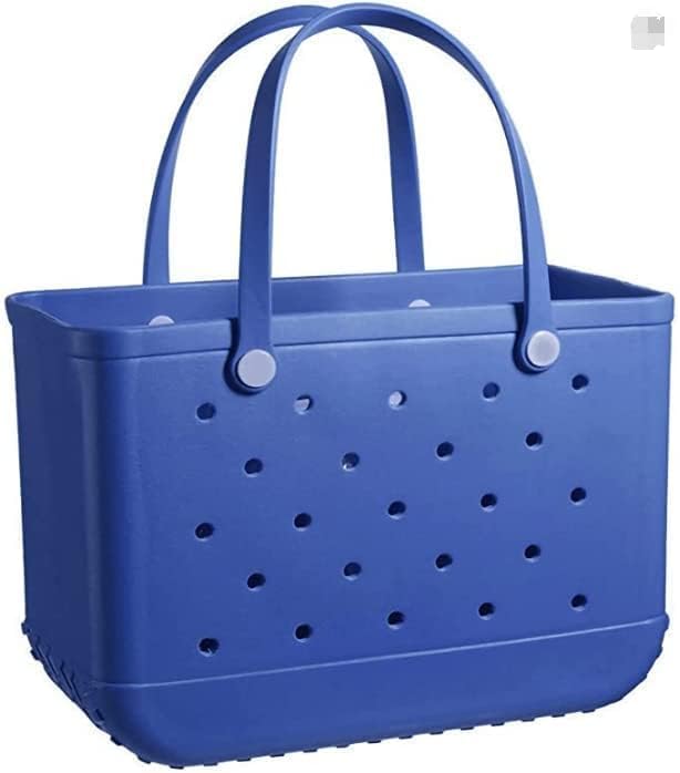 Beach scene featuring the waterproof drainage tote bag sitting on sand.