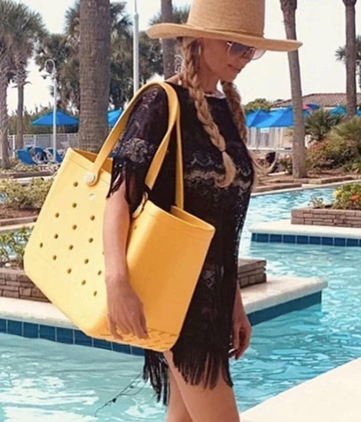 Large waterproof travel bag with bottom drainage, ideal for beach, gym, or pool accessories.