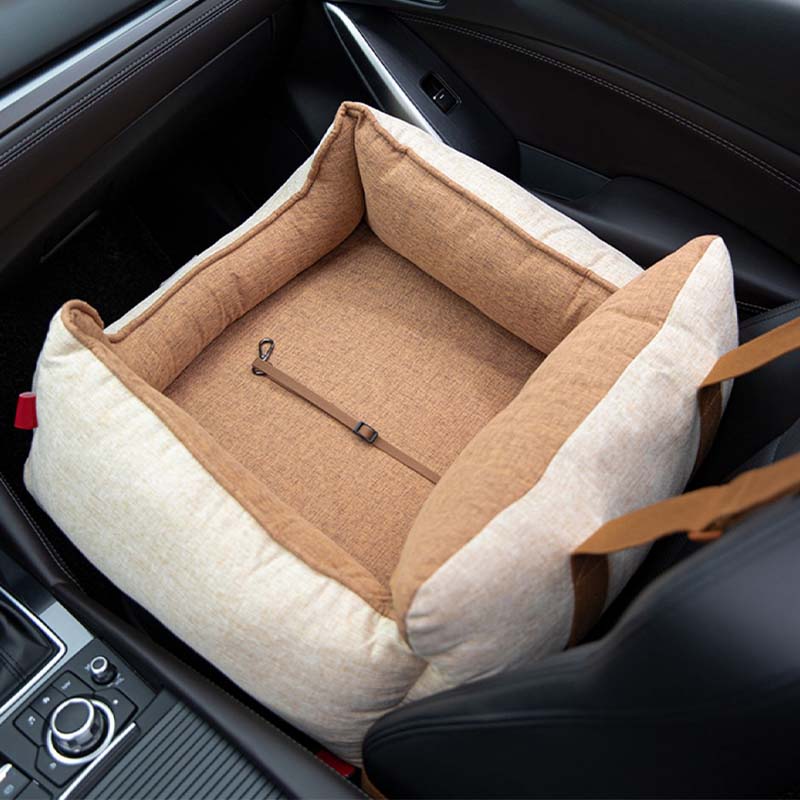 Dog travel bed with safety features, waterproof and easy to clean for pet owners