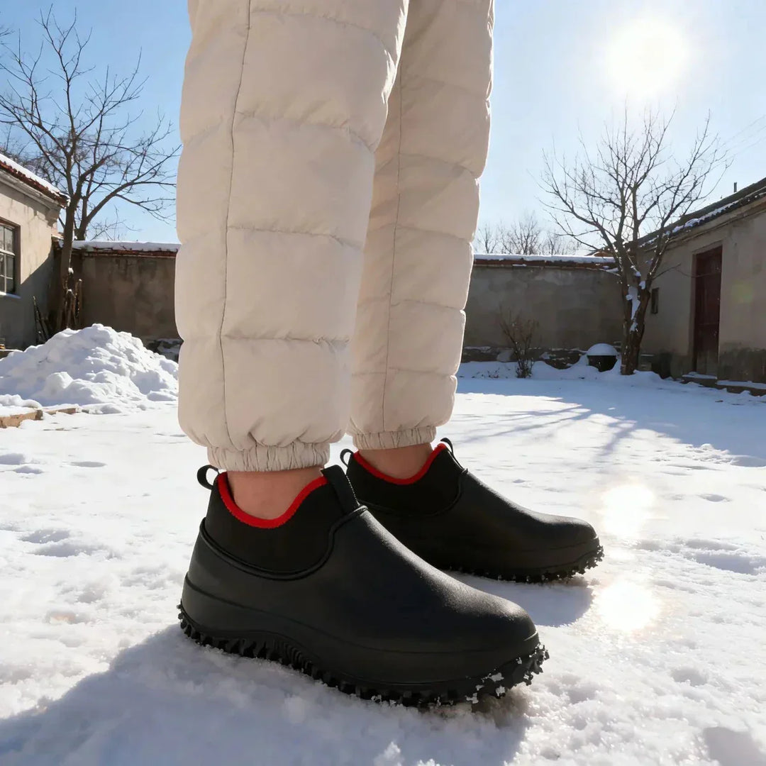 Durable, all-weather unisex waterproof work shoes with slip-resistant soles for industrial use.