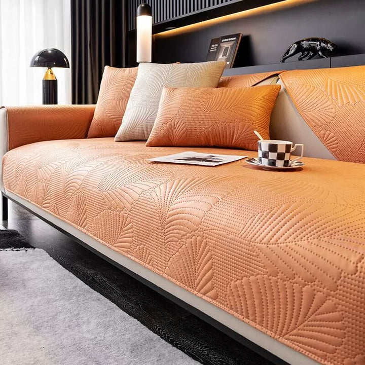 Corner detail of a scratch-resistant sofa cover, showing durable stitching for pets