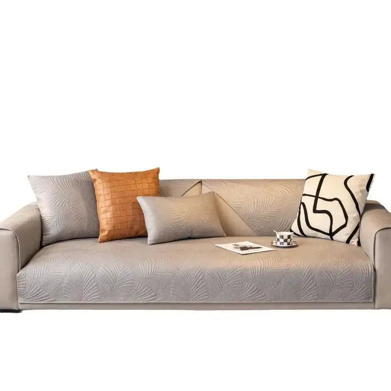 Lifestyle image of a pet relaxing on a protected sofa with a scratch-resistant cover